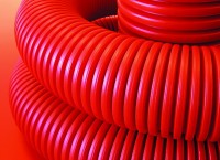 DKC Двустенная труба ПНД гибкая для кабельной канализации д.75мм с протяжкой,SN10, 490Н,  в бухте 100м, цвет красный 121975100 фото